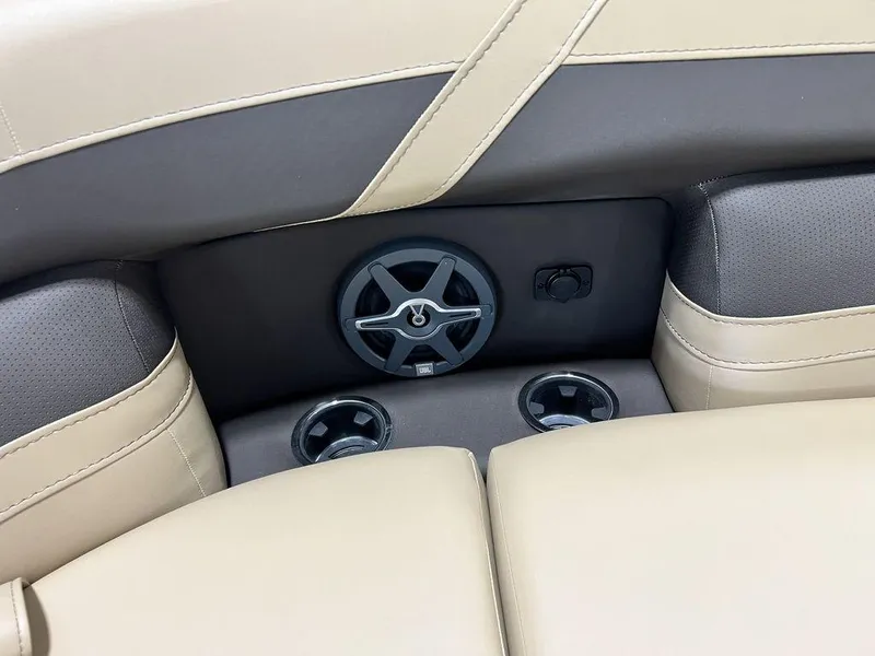 Slide: The Image of Barletta Cabrio C24UC 2025 boat interior with cup holders and speaker. - 6