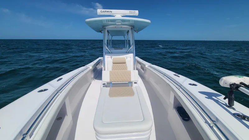 Slide: The Image of 2022 Front Runner 33 Center Console boat on open water. - 38