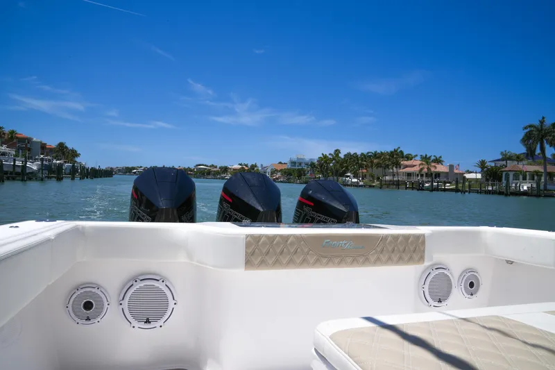 Slide: The Image of 2022 Front Runner 33 Center Console boat with triple engines on a sunny day. - 39