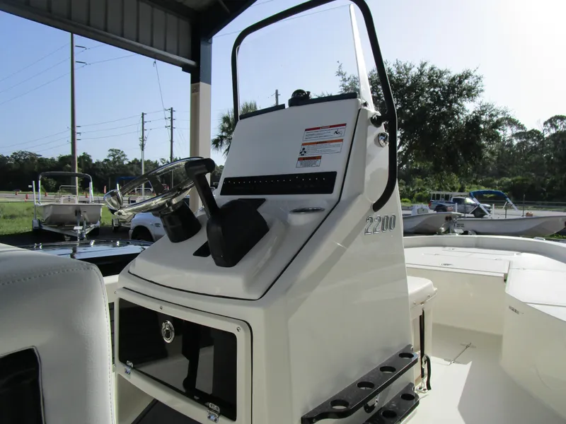 Slide: The Image of 2024 Pathfinder TRS 2200 boat console and steering wheel. - 13