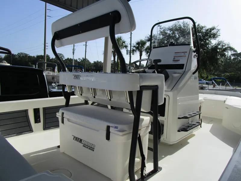 Slide: The Image of 2024 Pathfinder TRS 2200 boat interior with seating and console. - 5