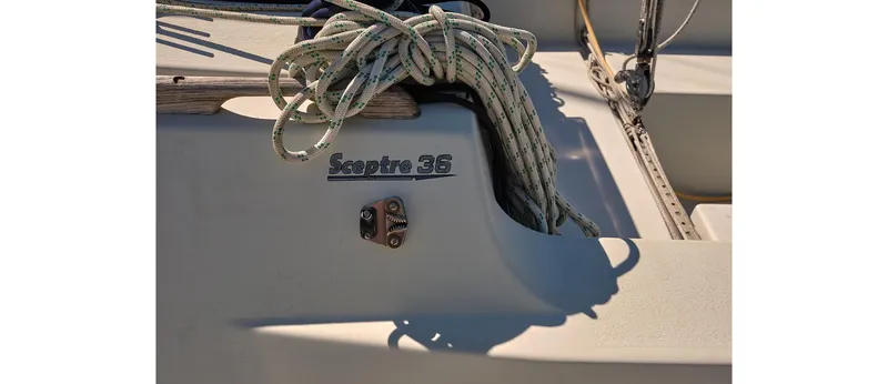 Slide: The Image of Close-up of a 1980 Sceptre 36 Athena sailboat deck with coiled rope. - 13