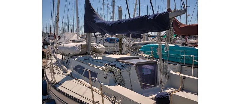 Slide: The Image of 1980 Sceptre 36 Athena sailboat docked in a marina, surrounded by other boats. - 15