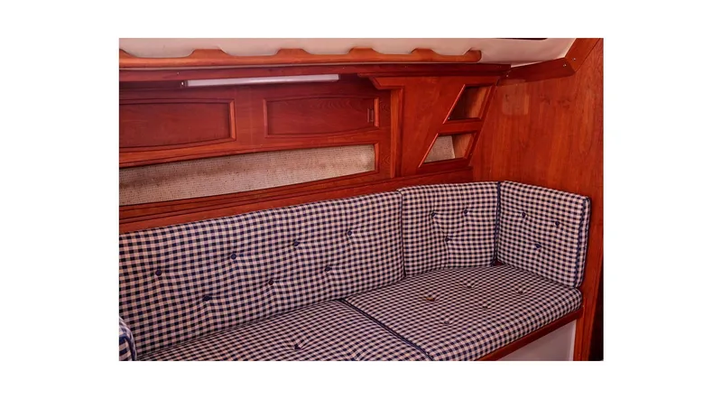 Slide: The Image of Interior of 1980 Sceptre 36 Athena yacht with checkered seating and wooden finish. - 21