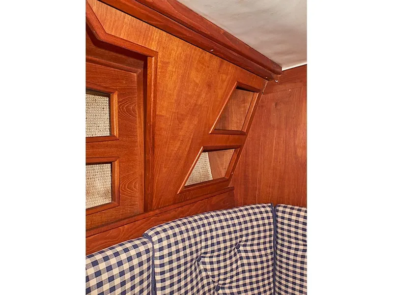 Slide: The Image of Interior of 1980 Sceptre 36 Athena yacht with wood paneling and checkered upholstery. - 23