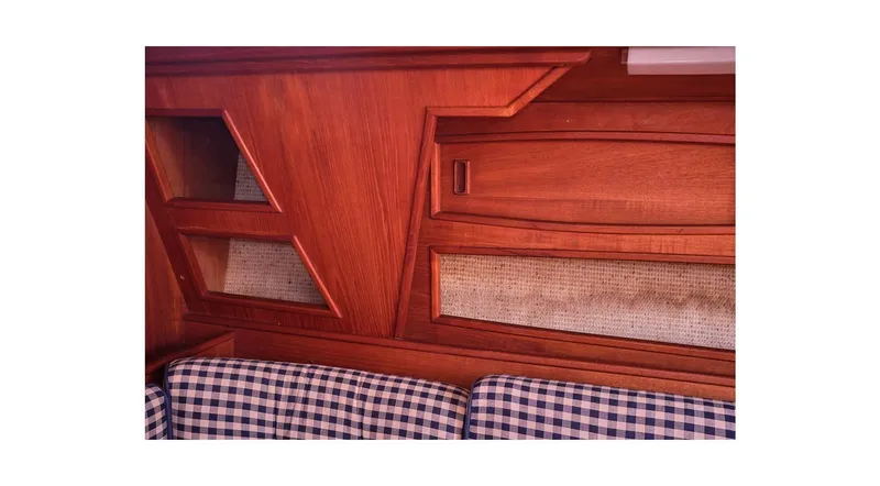 Slide: The Image of Interior of 1980 Sceptre 36 Athena yacht with wooden paneling and checkered upholstery. - 26