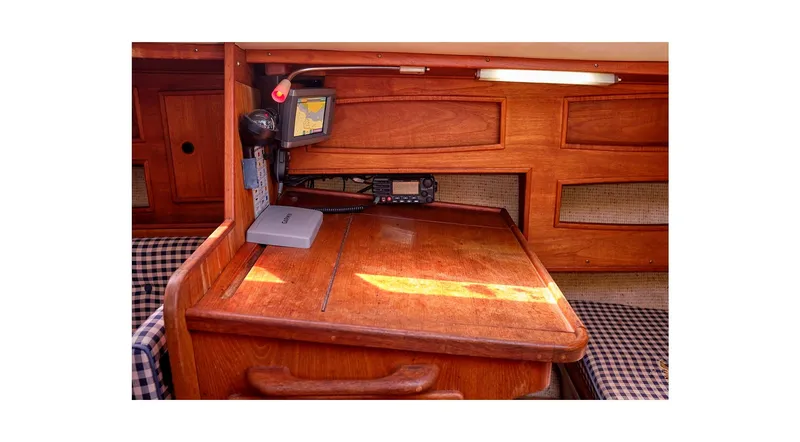 Slide: The Image of 1980 Sceptre 36 Athena yacht interior with wooden cabinetry and navigation equipment. - 31