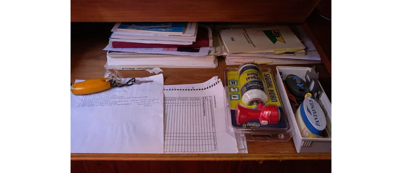 Slide: The Image of Drawer with organized papers, tools, and supplies on a Sceptre 36 Athena, 1980 model. - 35