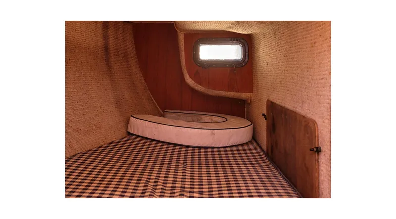 Slide: The Image of Cozy cabin interior of 1980 Sceptre 36 Athena sailboat with checkered bedding. - 39