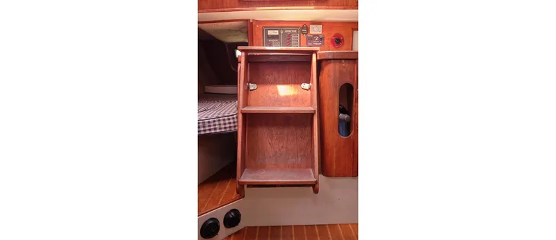 Slide: The Image of Interior of 1980 Sceptre 36 Athena yacht with wooden cabinetry and control panel. - 43