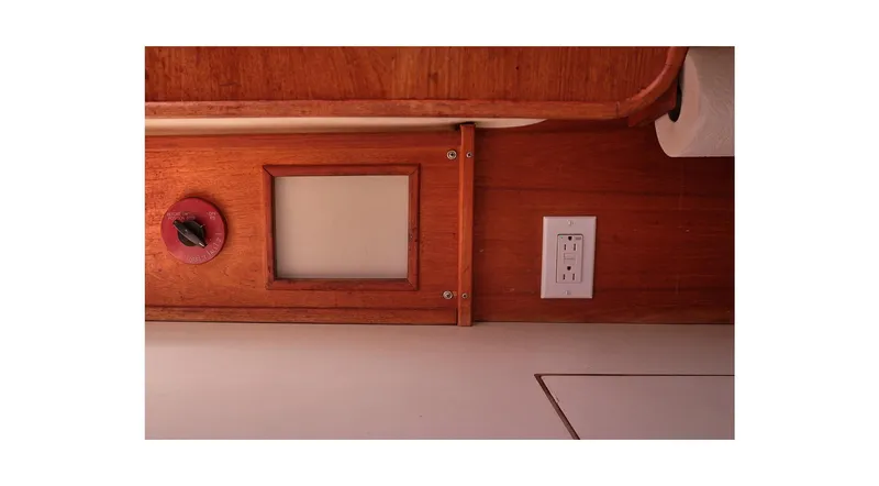 Slide: The Image of Interior of 1980 Sceptre 36 Athena yacht with wooden paneling and electrical outlet. - 46