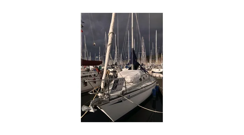 Slide: The Image of 1980 Sceptre 36 Athena sailboat docked in a marina under cloudy skies. - 5