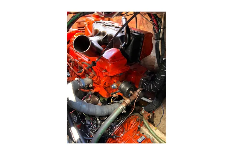 Slide: The Image of Engine of 1980 Sceptre 36 Athena, featuring vibrant orange components and intricate wiring. - 60
