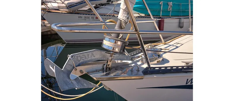 Slide: The Image of Bow of a 1980 Sceptre 36 Athena sailboat with anchor and railing. - 7