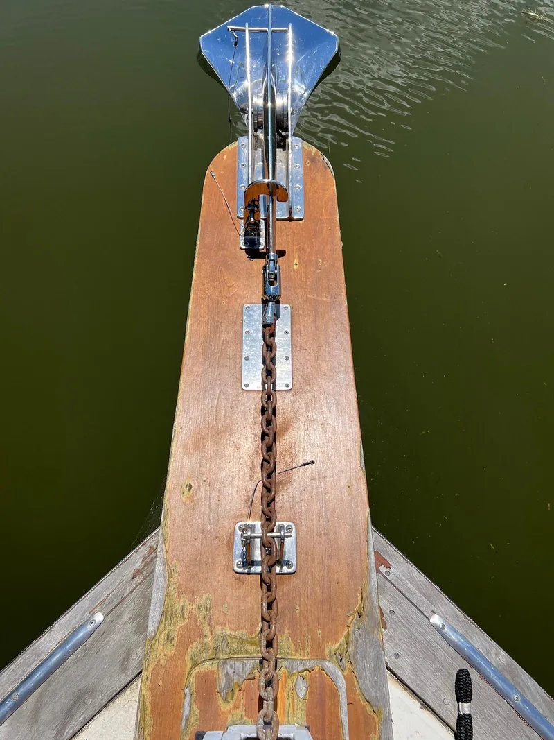 Slide: The Image of Bow of 1986 Midnight Lace 44 Flybridge Express Cruiser with anchor chain. - 12