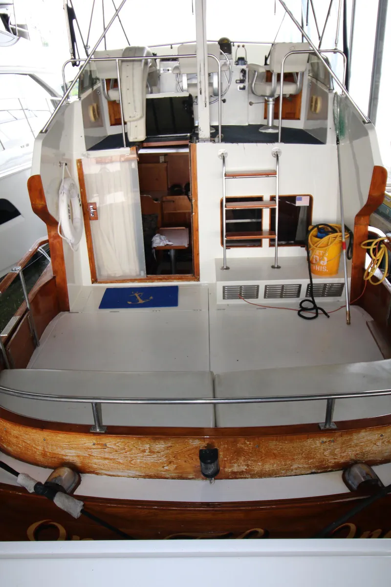 Slide: The Image of 1986 Midnight Lace 44 Flybridge Express Cruiser with spacious deck and cabin interior. - 4