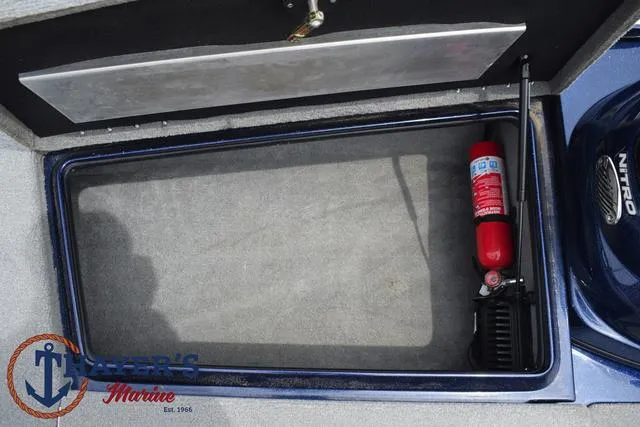 Slide: The Image of Storage compartment of a 2021 Nitro Z17 boat with fire extinguisher. - 12