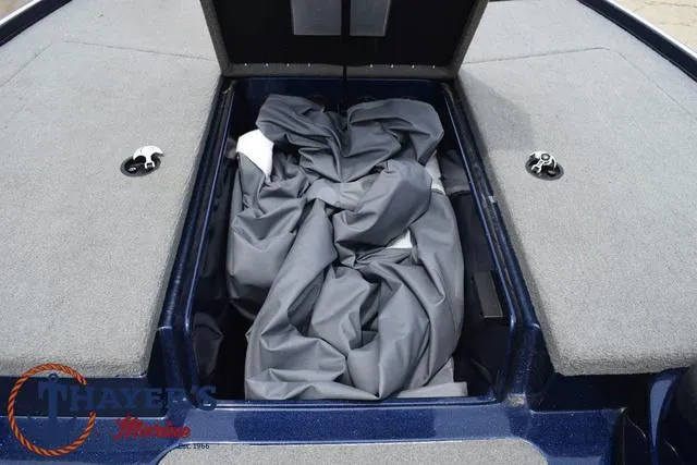Slide: The Image of 2021 Nitro Z17 boat storage compartment with cover, Thayer's Marine logo. - 13