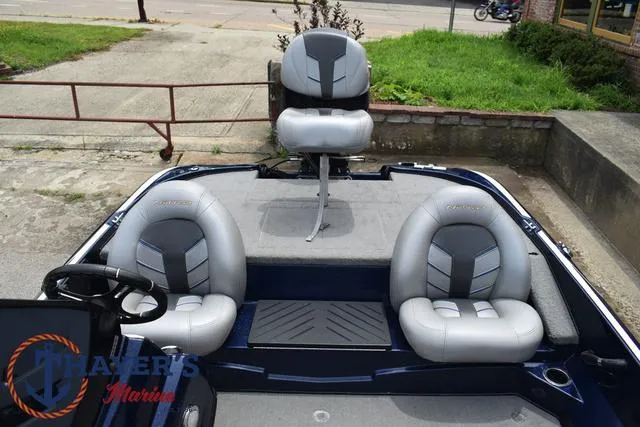 Slide: The Image of 2021 Nitro Z17 boat interior with three gray and black seats. - 16