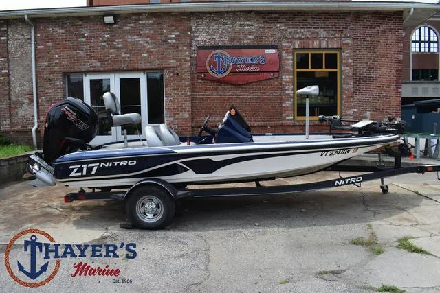 Slide: The Image of 2021 Nitro Z17 boat on trailer at Thayer's Marine dealership. - 2