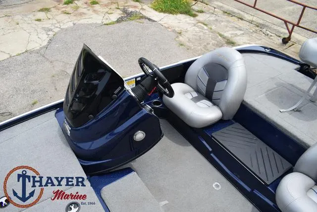 Slide: The Image of 2021 Nitro Z17 boat interior with steering console and seating, Thayer Marine logo. - 22