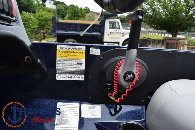 Slide: The Image of Nitro Z17 2021 boat control panel with safety instructions and throttle lever. - 25