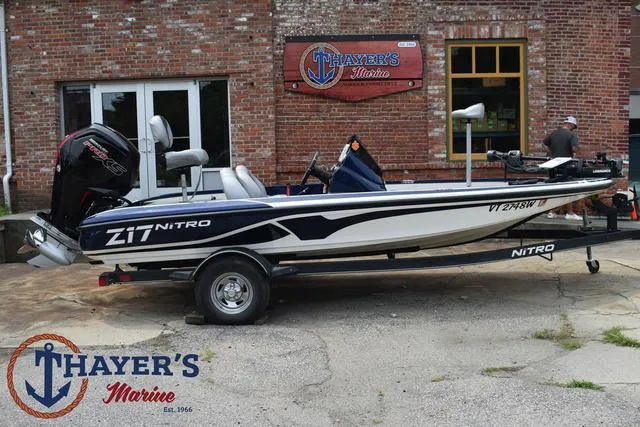 Slide: The Image of 2021 Nitro Z17 boat on trailer at Thayer's Marine dealership. - 38