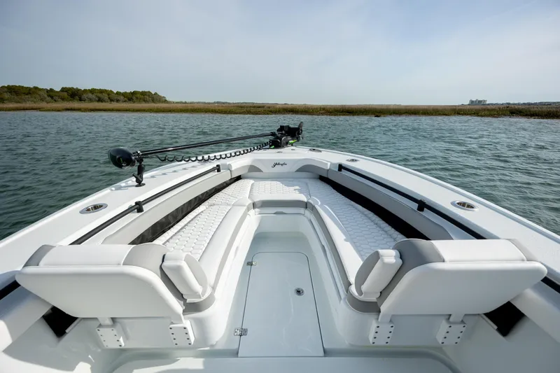 Slide: The Image of 2025 Yellowfin 26 Hybrid boat on water, featuring spacious seating and sleek design. - 20