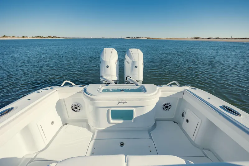 Slide: The Image of 2025 Yellowfin 32 boat with dual engines on open water. - 11
