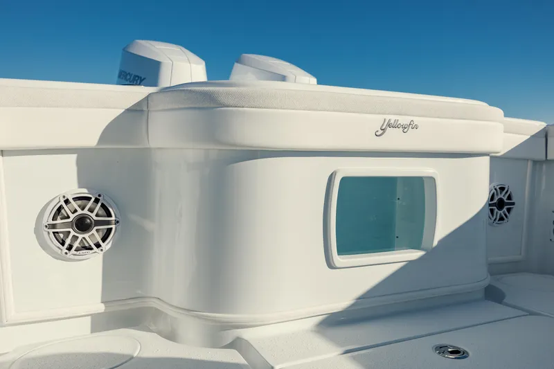 Slide: The Image of 2025 Yellowfin 32 boat interior with speakers and storage compartment. - 12