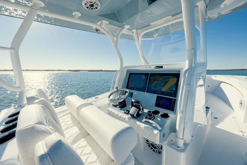Slide: The Image of 2025 Yellowfin 32 boat interior with advanced navigation system on a sunny day. - 19