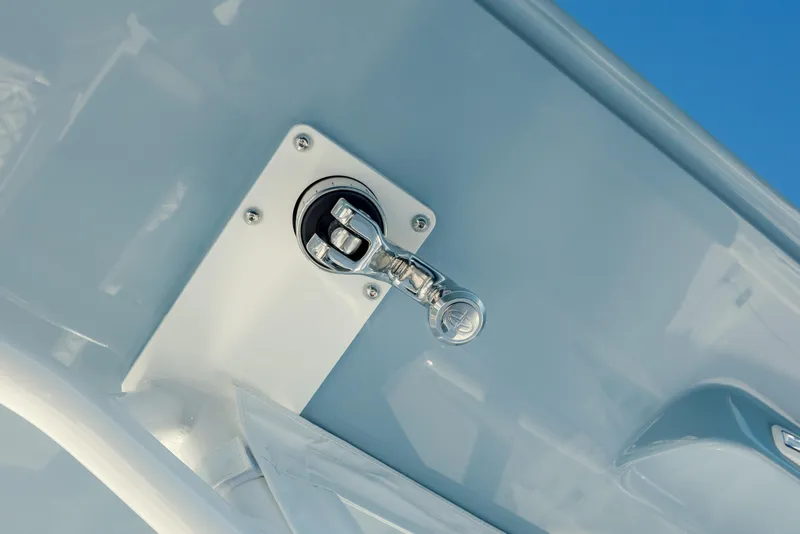 Slide: The Image of Close-up of a 2025 Yellowfin 32 boat component against a blue sky. - 22