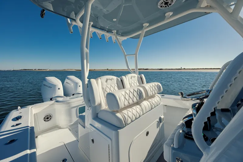 Slide: The Image of 2025 Yellowfin 32 boat interior with luxurious seating and ocean view. - 23