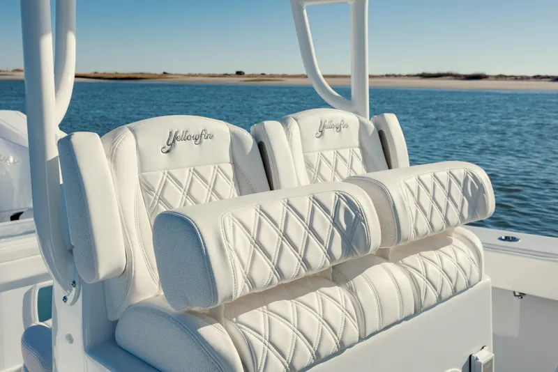 Slide: The Image of Luxurious seating on 2025 Yellowfin 32 boat with diamond-stitched upholstery, ocean backdrop. - 24