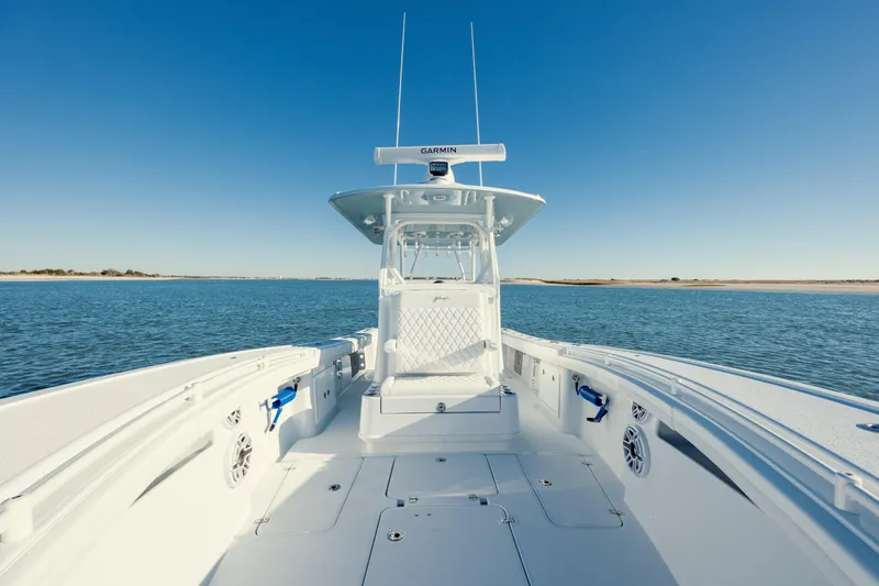 Slide: The Image of 2025 Yellowfin 32 boat on open water, clear sky, spacious deck. - 26