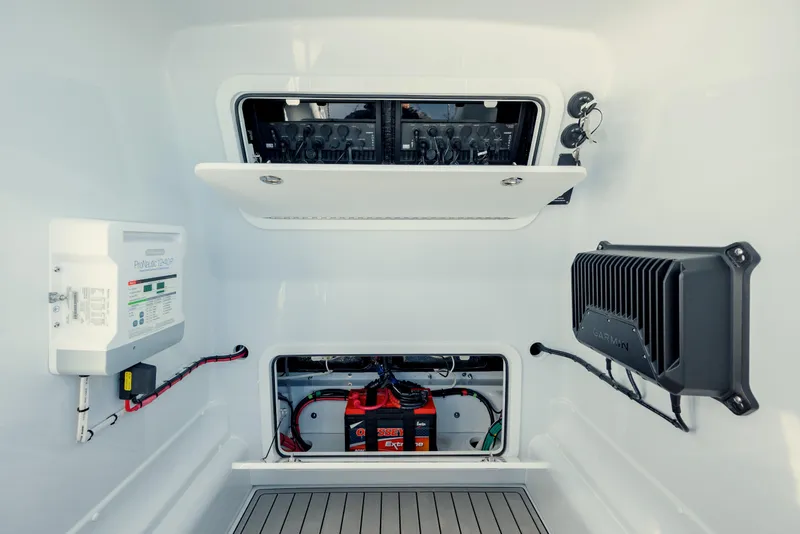 Slide: The Image of 2025 Yellowfin 32 boat electrical compartment with battery and control systems. - 33