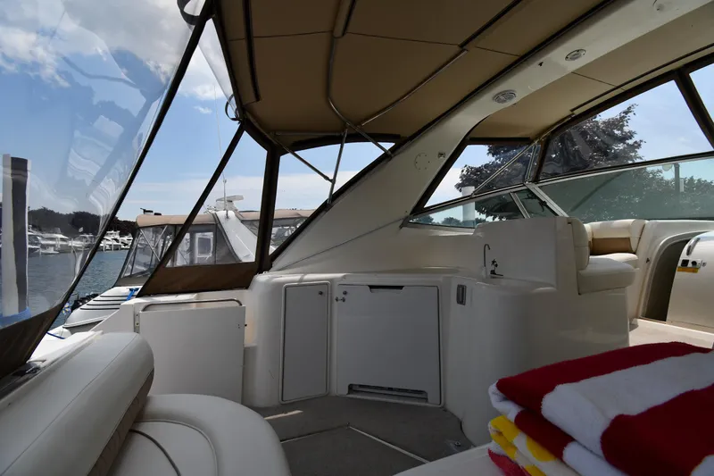 Slide: The Image of 1998 Cruisers Yachts 3870 Express interior with marina view. - 19