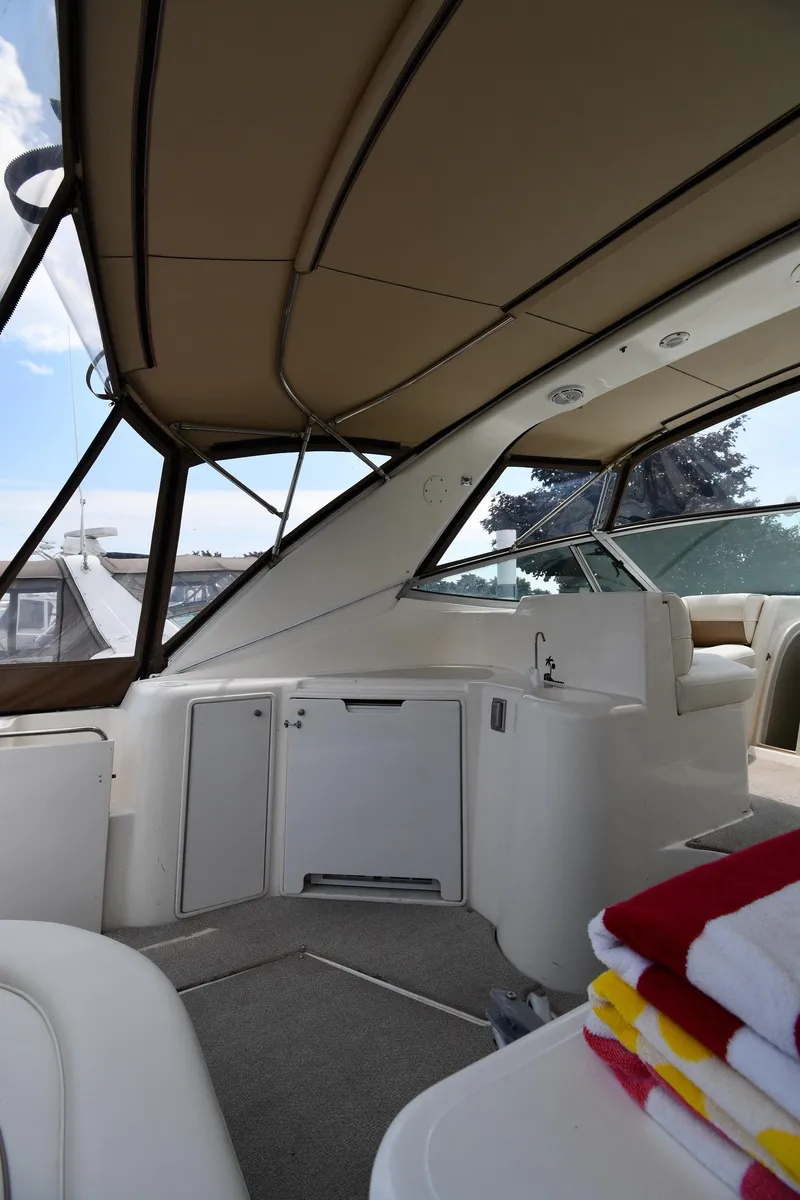 Slide: The Image of 1998 Cruisers Yachts 3870 Express interior with seating and storage. - 20