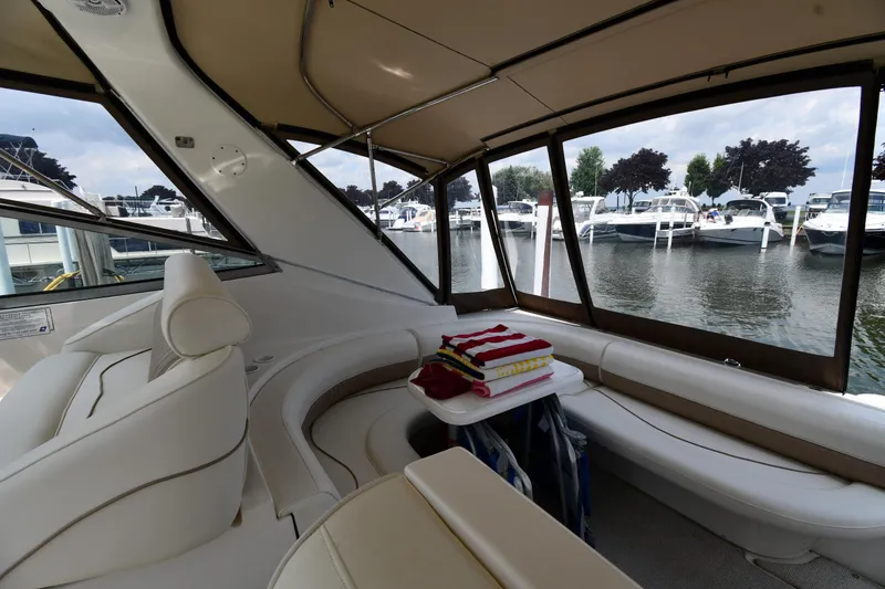 Slide: The Image of 1998 Cruisers Yachts 3870 Express interior with marina view. - 24
