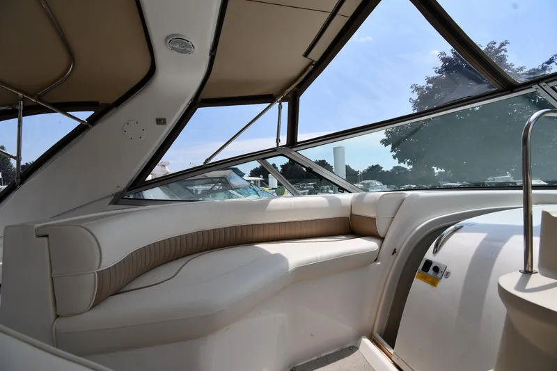 Slide: The Image of Interior seating area of 1998 Cruisers Yachts 3870 Express with panoramic windows. - 25