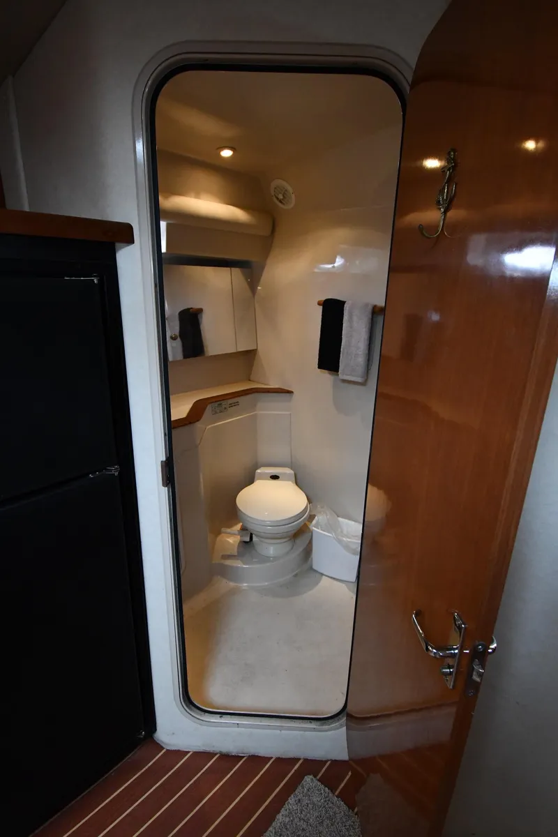 Slide: The Image of 1998 Cruisers Yachts 3870 Express bathroom with modern amenities. - 42