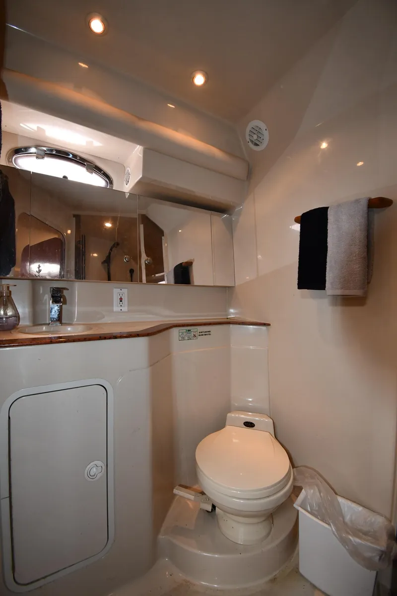 Slide: The Image of 1998 Cruisers Yachts 3870 Express bathroom with modern fixtures and ample storage. - 43