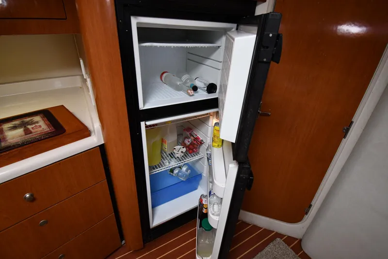 Slide: The Image of Open refrigerator in 1998 Cruisers Yachts 3870 Express galley. - 48
