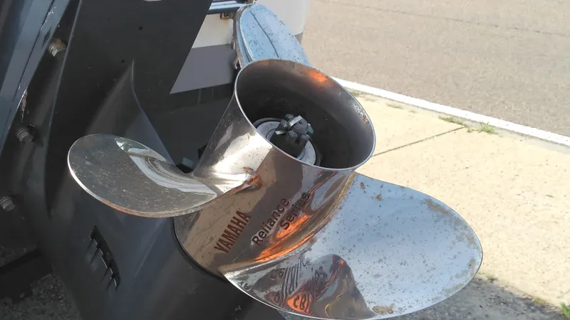 Slide: The Image of Close-up of Yamaha propeller on 2021 Wellcraft 202 Fisherman boat. - 10