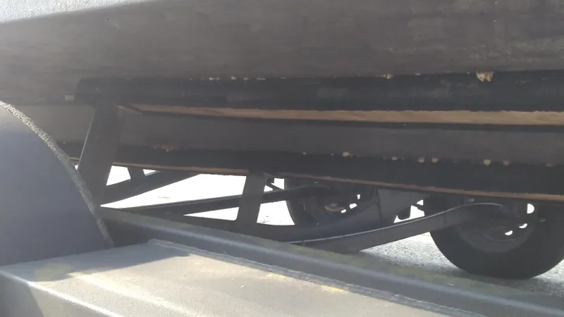 Slide: The Image of Underside view of 2021 Wellcraft 202 Fisherman boat on trailer. - 12