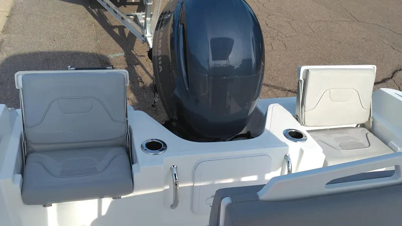 Slide: The Image of 2021 Wellcraft 202 Fisherman boat with seating and outboard motor. - 17