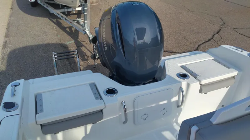 Slide: The Image of 2021 Wellcraft 202 Fisherman boat stern with outboard motor and seating. - 20