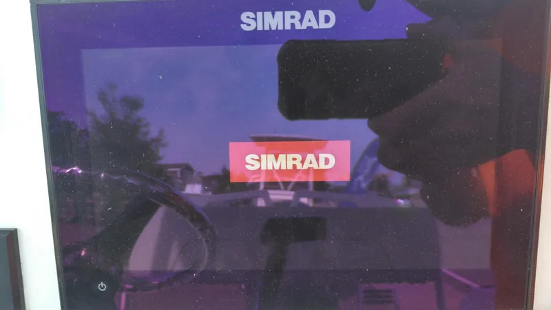 Slide: The Image of Simrad display on 2021 Wellcraft 202 Fisherman boat. - 24