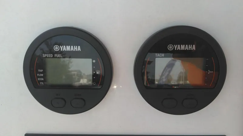 Slide: The Image of Yamaha speed fuel and tach gauges on a 2021 Wellcraft 202 Fisherman boat. - 25