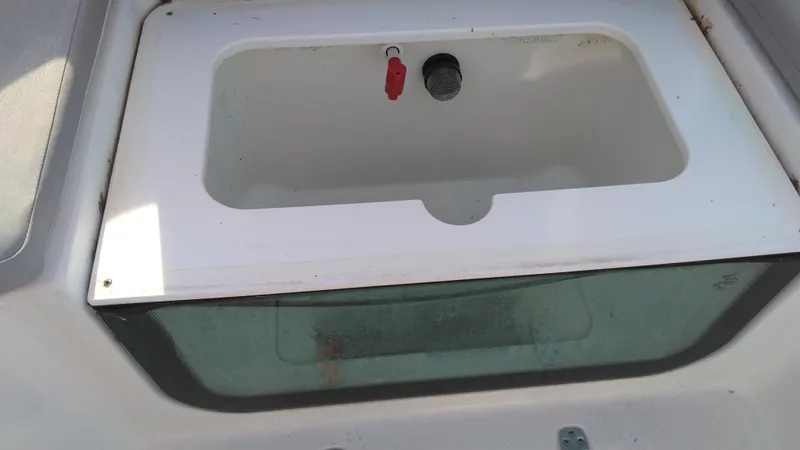 Slide: The Image of Livewell compartment in a 2021 Wellcraft 202 Fisherman boat. - 29